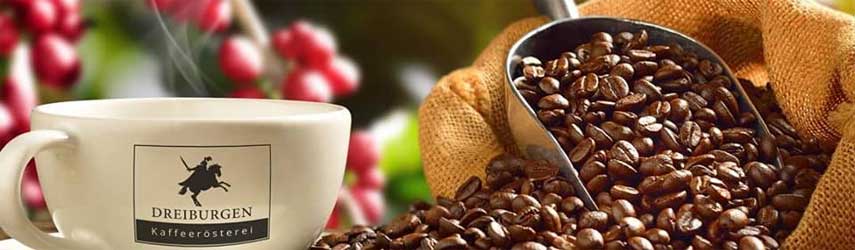 kaffeeroesterei-dreiburgen Kaffeetasse mit Bohnen und einer Schaufel